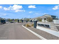 Gated Coldwater community entrance with well-maintained landscaping and clear signage on a sunny day at 2324 E Marguerite Ave, Phoenix, AZ 85040