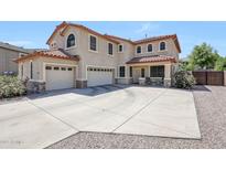 Beautiful two-story home featuring a three-car garage and a meticulously kept front yard at 2726 S 160Th Ave, Goodyear, AZ 85338