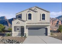 Two-story home with a two car garage, neutral color palette, and desert landscaping at 5058 E Umber Rd, San Tan Valley, AZ 85143