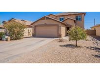Charming two-story home with a well-maintained front yard and attached two-car garage at 5305 E Silverbell Rd, San Tan Valley, AZ 85143