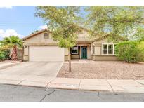 Charming single-story home featuring a two-car garage and inviting front yard landscaping at 7425 N 75Th Dr, Glendale, AZ 85303
