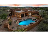 Inviting backyard pool and patio area offering a tranquil outdoor living space at 7728 E Mary Sharon Dr, Scottsdale, AZ 85266