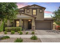 Charming two-story home featuring a well-manicured lawn and a neutral color palette at 10221 E Wavelength Ave, Mesa, AZ 85212