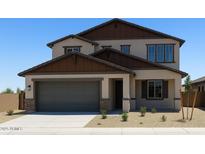 Charming two-story home featuring a gray two-car garage, complemented by a well-maintained, xeriscaped front yard at 20645 N 226Th Ln, Surprise, AZ 85387