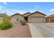 Beautiful home with a two-car garage, desert landscaping, and modern design elements at 2148 W Angelo Way, San Tan Valley, AZ 85144