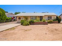 Charming single-story home with desert landscaping, a quaint front yard, and a welcoming entrance at 3247 E Sheridan St, Phoenix, AZ 85008