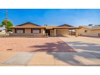 Charming single-story brick home featuring a carport and low-maintenance desert landscaping at 3901 W Augusta Ave, Phoenix, AZ 85051