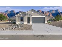 Charming single-story home featuring a gray exterior, a two-car garage, and desert landscaping at 46422 W Lander Ln, Maricopa, AZ 85139