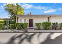 Charming single-story home featuring a tidy front yard, desert landscaping and a freshly painted exterior at 4800 N 68Th St # 207, Scottsdale, AZ 85251