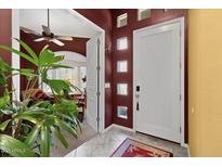 Inviting front entrance with tiled floors and a decorative front door with sidelight windows at 742 W Puget Ave, Phoenix, AZ 85021
