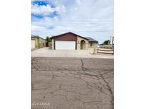 Charming single-Gathering home featuring a two-car garage and traditional desert landscaping at 9601 N 35Th Dr, Phoenix, AZ 85051