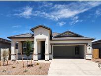Charming single story home with desert landscaping, neutral paint, and a two car garage at 10524 W Bloch Rd, Tolleson, AZ 85353