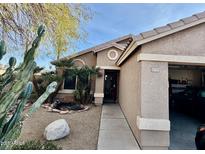 Charming single-story home featuring desert landscaping and a welcoming front entrance at 10705 W Montecito Ave, Phoenix, AZ 85037