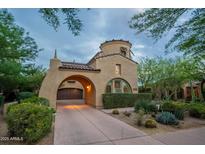 Beautiful Mediterranean home featuring an attached garage, desert landscaping, and distinctive architecture at 18283 N 93Rd St, Scottsdale, AZ 85255