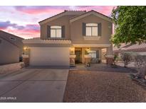 Charming two-story home featuring a two-car garage and welcoming front porch at 23693 W Grove St, Buckeye, AZ 85326