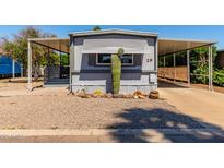 Charming gray home with desert landscaping, covered parking, and number 29 clearly displayed at 2650 W Union Hills Dr # 29, Phoenix, AZ 85027