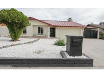 Charming single-story home featuring an updated roof and a low maintenance xeriscaped front yard at 4115 W Sierra St, Phoenix, AZ 85029