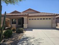 Charming single-story home with a tile roof and a two-car garage at 4255 E Rock Dr, San Tan Valley, AZ 85143