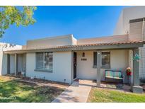 Charming single-story home with covered porch, desert landscaping, and inviting curb appeal at 8309 E Rose Ln, Scottsdale, AZ 85250