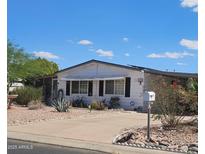 Cozy one-story home with well-maintained landscaping and a private driveway at 8709 E Coralbell Ave, Mesa, AZ 85208