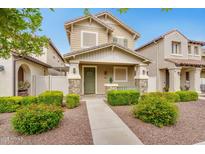 Charming two-story home with a well-maintained front yard and welcoming entrance at 1069 S Nancy Ln, Gilbert, AZ 85296