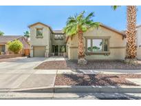 Charming two-story home featuring desert landscaping, and an attached two-car garage at 11580 N 145Th Ave, Surprise, AZ 85379