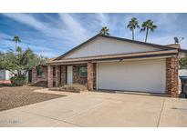 Charming brick home featuring a spacious two-car garage and well-manicured landscaping at 15841 N 23Rd Pl, Phoenix, AZ 85022