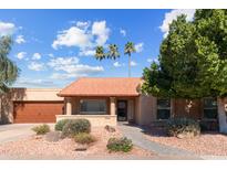 Charming single-story home featuring three mature palm trees and a well-manicured, desert-style front yard at 2328 W Nopal Ave, Mesa, AZ 85202
