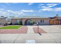 Charming single-story home featuring a quaint walkway, well-manicured landscaping, and a unique arched entryway at 2727 W Libby St, Phoenix, AZ 85053