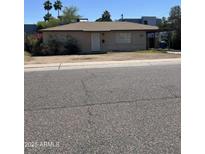 Charming single-story home with a low-pitched roof and a simple front door at 3317 N 10Th Ave, Phoenix, AZ 85013
