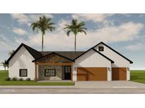 Beautiful single-story home featuring a stone-clad entryway, a neutral palette, and an attached two-car garage at 3913 E Campbell Ave, Phoenix, AZ 85018
