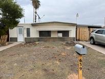 Quaint single-story home with mailbox out front at 639 S 92Nd Pl, Mesa, AZ 85208