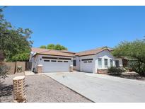 Charming single-story home featuring a three-car garage, neutral paint and tile roof at 7126 W Ocotillo Rd, Glendale, AZ 85303