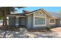 Charming single-story home with desert landscaping, covered entry, and neutral paint at 860 N Mcqueen Rd # 1157, Chandler, AZ 85225