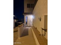 Inviting front entrance with ornate door detail, showcasing a secure and stylish entryway at 9060 N 47Th Ln, Glendale, AZ 85302