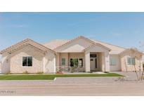 Charming single-story home with stone accents and well-manicured lawn at 1229 N 106Th Pl, Mesa, AZ 85207