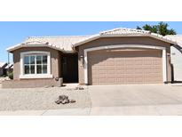 Charming single-story home with desert landscaping, a two-car garage, and a neutral color palette at 1320 E Bellerive Dr, Chandler, AZ 85249