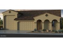 Charming home with a tile roof, arched entry and 3-car garage at 17805 W Vermont Ave, Litchfield Park, AZ 85340