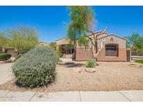 Charming single-story home with desert landscaping and neutral-toned stucco exterior at 18322 W Sweet Acacia Dr, Goodyear, AZ 85338