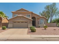 Charming two-story home with desert landscaping and a two-car garage at 321 W Betsy Ln, Gilbert, AZ 85233