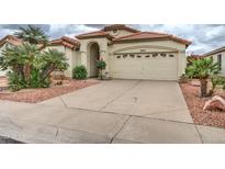 Charming single-story home featuring a well-manicured yard, neutral paint, tile roof, and a two-car garage at 3631 E Long Lake Rd, Phoenix, AZ 85048