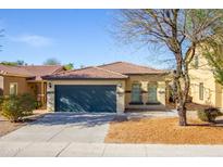 Charming single-story home with a two-car garage and a well-maintained front yard in a desirable community at 44944 W Miramar Rd, Maricopa, AZ 85139