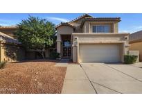 Charming two-story home with a well-maintained front yard and inviting entrance at 4753 E Bighorn Ave, Phoenix, AZ 85044