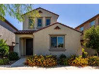 Charming two-story home with desert landscaping and a welcoming covered entry at 4901 S Turbine --, Mesa, AZ 85212