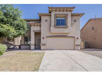 Charming two-story home showcasing a well-manicured front yard and a spacious two-car garage at 11016 W Griswold Rd, Peoria, AZ 85345