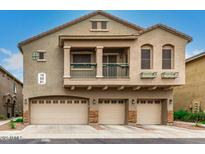 Two-story home with a three-car garage and a small balcony at 16620 S 48Th St # 79, Phoenix, AZ 85048