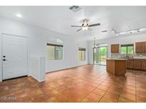 Open-concept living room with tile floors and natural light at 16620 S 48Th St # 79, Phoenix, AZ 85048