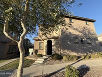 Inviting two-story home with a stone-accented entryway and well-maintained landscaping at 1730 W Pollack St, Phoenix, AZ 85041