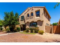 Charming two-story home with a desert landscape and walkway to the front door at 3476 E Orchid Ln, Gilbert, AZ 85296