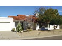 Charming single-story home features a desert landscaped yard and a classic red tile roof at 8626 E Irish Hunter Trl, Scottsdale, AZ 85258
